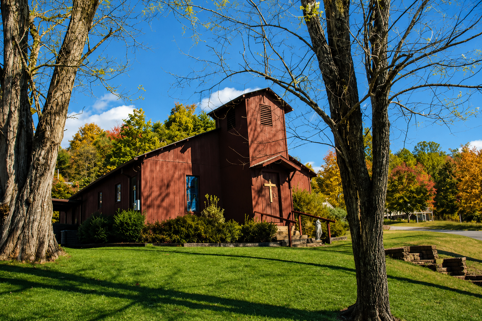 Love Valley Presbyterian Church surrounded by trees in autumn